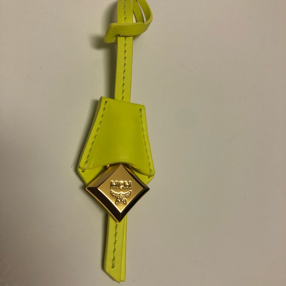 MCM neon yellow “green” and gold bag charm